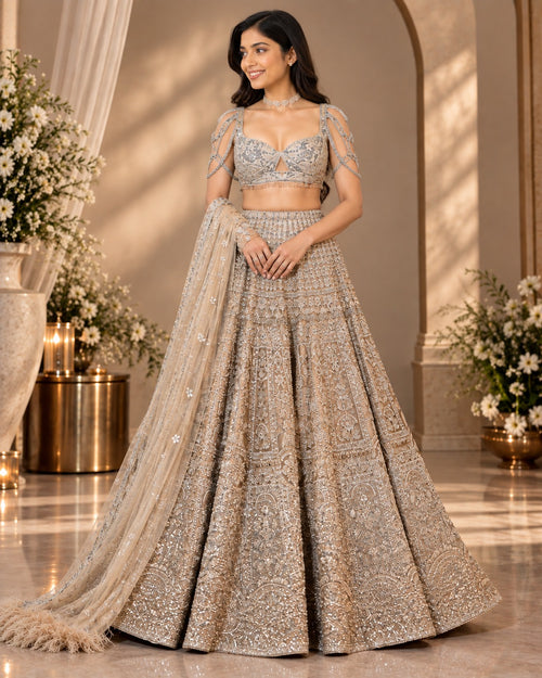 Champagne gold embroidered lehenga set with embellished blouse and dupatta by Silai Parampara Studio