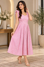 Pink gingham women's dress with floral embroidery style detailing and ruffle sleeves
