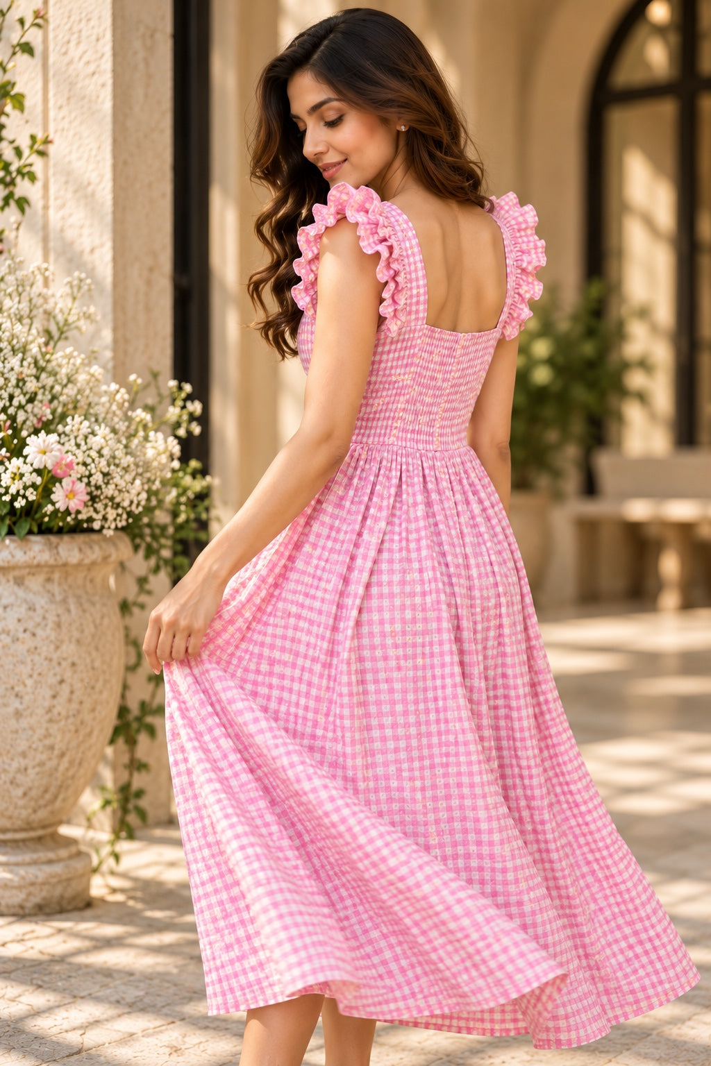 Full front view of pink gingham floral women's dress with flowing midi skirt