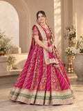 Rani pink printed lehenga set with embroidered choli, flared skirt and embellished dupatta