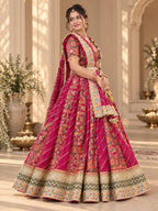 Rani pink printed lehenga set with ornate border detailing and flowing dupatta