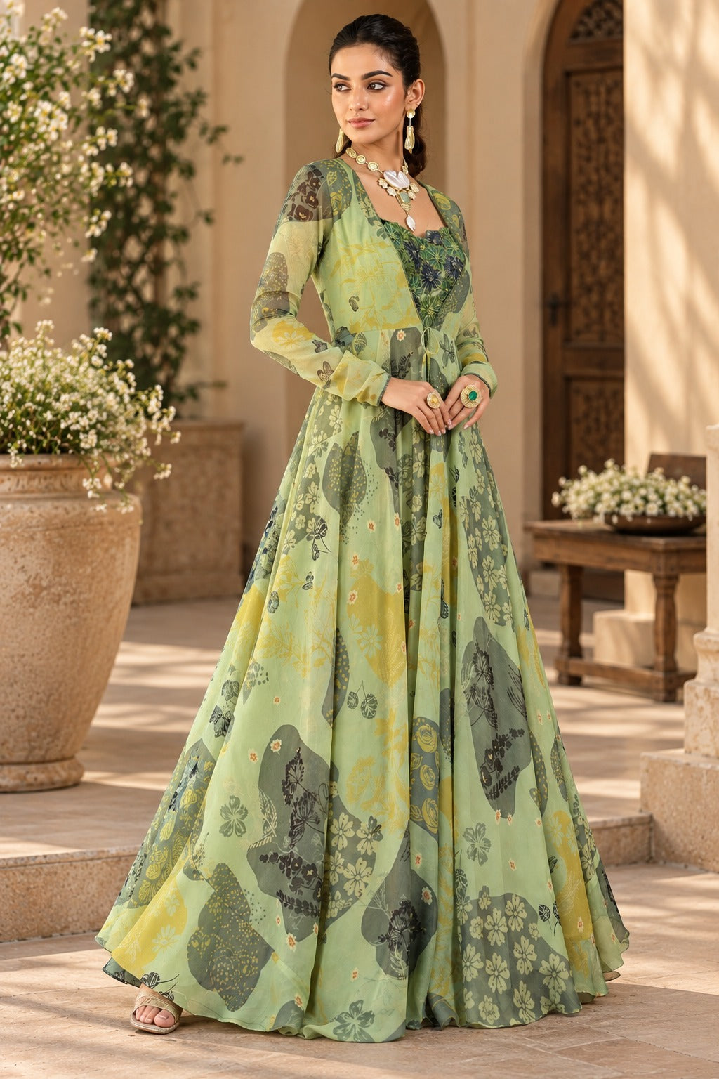 Sage green floral printed gown with floral motifs and sheer sleeves, three-quarter view, Silai Parampara Studio