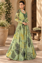 Sage green floral printed gown with floral motifs and sheer sleeves, three-quarter view, Silai Parampara Studio